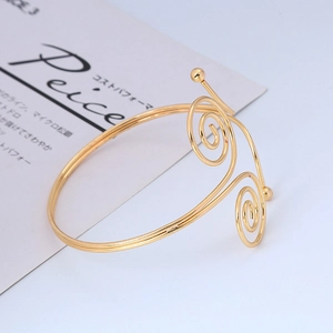 Adjustable golden double-layer spiral arm cuff with exotic vintage metal finish
