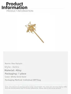 Detailed close-up of a gold-toned vintage bee hair clip with intricate hollowed wings