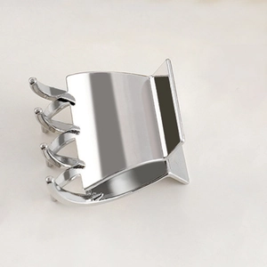 Polished silver metal hair claw clip with reflective finish and minimalist design
