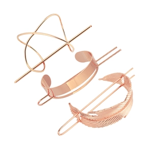 Three-piece rose gold metal hair pin set featuring leaf, feather and geometric shapes