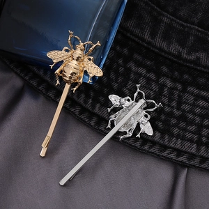 Elegant gold and silver bee shaped metal hair clips with detailed wings for stylish women