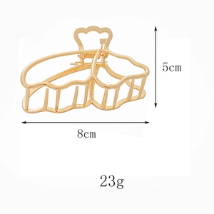 Golden butterfly hair claw clip detailed view with dimensions 8cm by 5cm and 23g weight