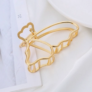Elegant hollow metal butterfly hair claw clip in light gold for stylish women