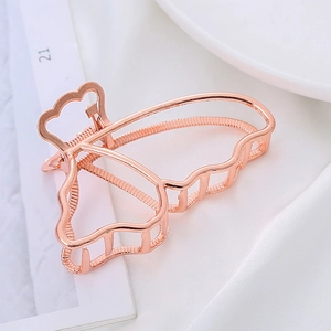 Elegant rose gold hollow butterfly hair claw clip with metallic finish for women