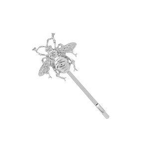 Close-up of a silver metal bee hair clip showing detailed wings and lifelike texture