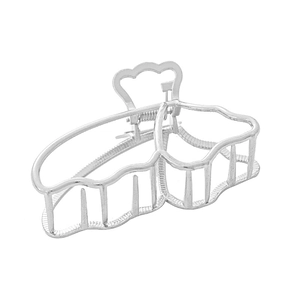 Detail view of silver hollowed metal hair claw clip with strong spring and grip teeth