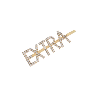 Golden hair clip with EXTRA rhinestone lettering on a clean white background