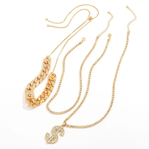 Detailed view of hip hop jewelry set with gold Cuban chain and iced out dollar sign pendant