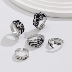 Set of five gothic rings with skulls and black gemstones in antique silver finish