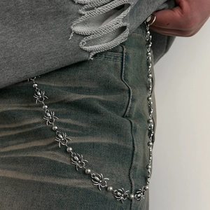 Punk silver metal pants chain with spider charms on vintage jeans for street style
