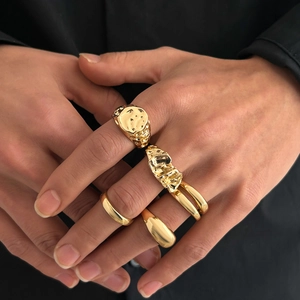 Men's hip-hop gold liquid metal rings set with irregular lava fold texture on a model