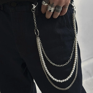 Detail of a multi-layer hip hop trousers chain with pearls and silver metal links