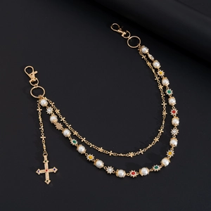 Multilayer gold pearl pants chain with colorful flower accents and a jeweled cross pendant