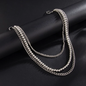 Detail of silver triple-layered metal hip hop pant chains with ball and link strands