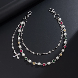 Detailed macro view of triple-layered silver hip-hop pants chain with colorful rhinestones