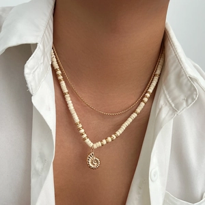 Men's double-layered necklace with coconut beads and golden nautilus shell pendant