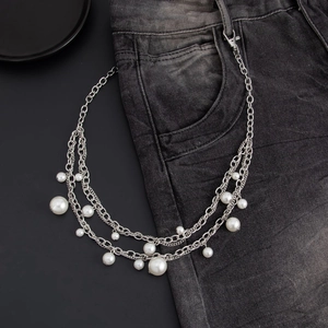 Hip-hop silver multilayer chain with pearls and lobster clasp on black jeans