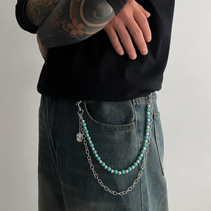 Double-layer turquoise beaded waist chain with silver alloy rings on denim jeans