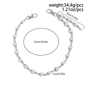 Detailed view of silver cross pendant pant chain with white pearls and size measurements