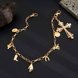 Golden hip-hop pant chain with cross, cowboy boots and lucky horseshoe charms on black stone