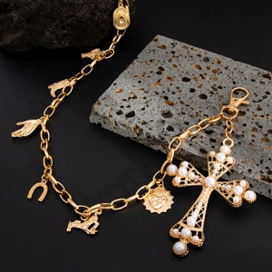Hip hop punk gold waist chain with pearl cross and good luck charms on volcanic rock