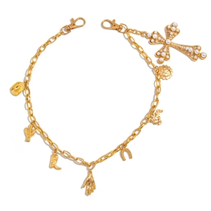 Golden multi-pendant charm chain with cowboy hat, boots, and faux pearl cross on white
