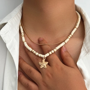 Men's double layer necklace with gold chain, white coconut beads and starfish pendant
