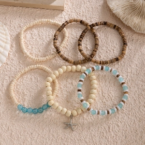 Bohemian style coconut shell beaded bracelet set with starfish metal charm detail