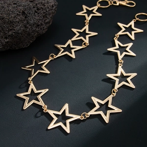 Hip hop style gold hollow pentagram star waist chain with lobster clasp on black background