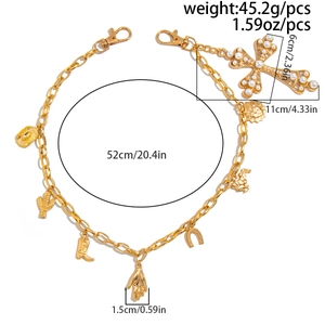 Detail view of hip-hop waist chain with faux pearl cross pendant and western charms