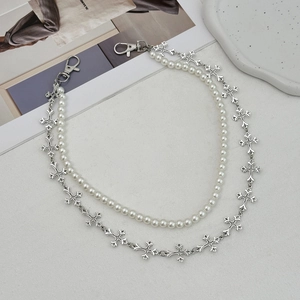 Double-layered silver cross chain and white pearl necklace with lobster clasps