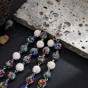 Detail of colorful rhinestone ball chains with silver lobster clasps for hip-hop style