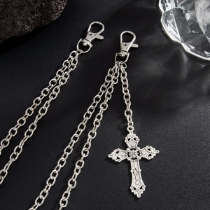 Detail of silver multi-layer waist chains with retro engraved cross pendant and lobster clasps