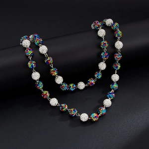 Macro shot of silver hip hop waist chain with colorful and white rhinestone-encrusted balls