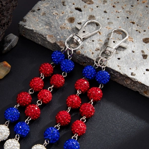 Close-up of hip hop trouser chain featuring colorful rhinestone balls and metal lobster clasp