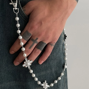 Hip hop pearl trousers chain with sparkling cross pendants on black denim jeans