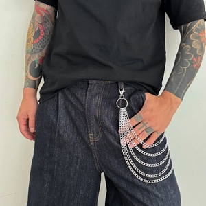 Detail of layered silver metal hip-hop pants chain with multi-layer rings and lobster clasps