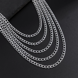Detail shot of multi-layer silver curb chains with a polished finish for industrial style