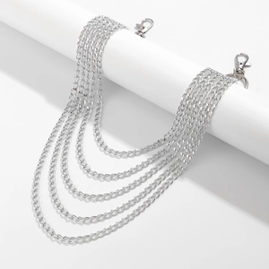 Detail of five-layer silver metal trouser chain with lobster clasps and layered link design