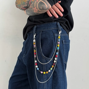 Multilayer hip hop wallet chain with colorful rhinestone beads hanging on denim jeans