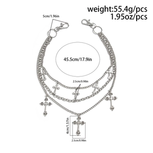 Detail of triple-layer silver metal pants chain with engraved cross pendants and lobster clasps