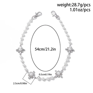Detail showing pearl chain dimensions with rhinestone cross charms and lobster clasps