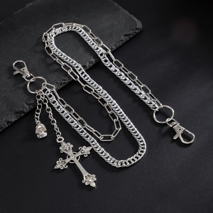 Silver gothic layered trousers chain with skull and cross pendants on black stone