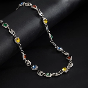 Macro shot of silver hip hop necklace with colorful cushion-cut stones and zircon accents