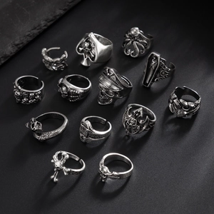 Detailed view of 13-piece gothic punk rings featuring skulls and vintage silver textures