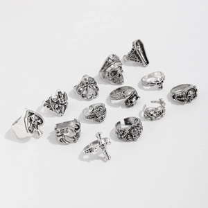 Detailed view of 13-piece gothic punk ring set featuring skull and cross motifs