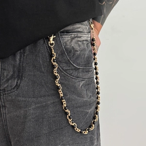 Hip hop pearl trousers chain with gold metal links and black beads on grey jeans