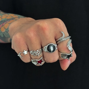 Gothic punk ring set for men with star and snake designs on black background