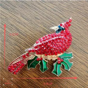 Macro shot of red rhinestone cardinal bird brooch with dimensions 5.9cm x 4.2cm and 11g weight