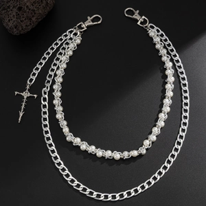 Close-up of layered hip-hop pants chain with silver metal link and pearl cross pendant